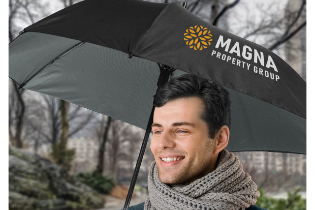 Holding Promotional Umbrella and Smiling