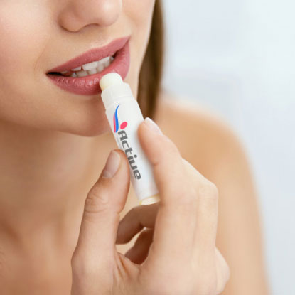 Women applying branded lip balm