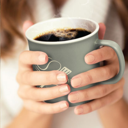 Holding Promotional Coffee Mug In Hands