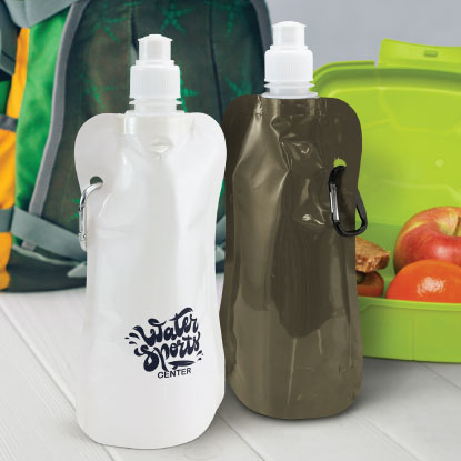 Two promotional collapsible bottles next to lunch box