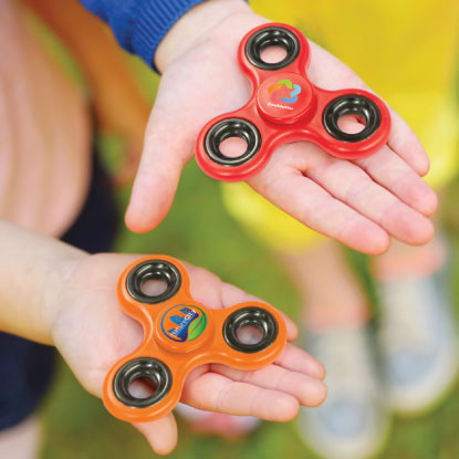 Kids holding promotional fidget spinners