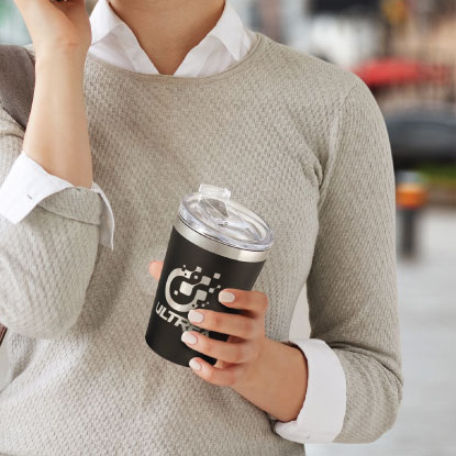 Woman holding swisspeak coffee cup