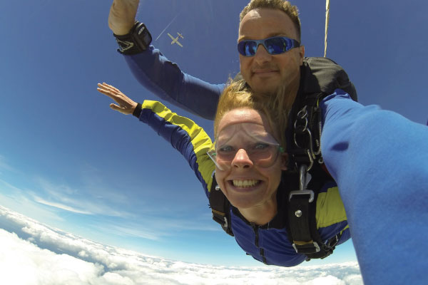 Man and women skydiving