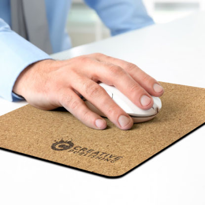 Corporate worker using a cork mouse mat with logo engraving
