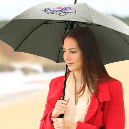 Young woman holding heather promotional umbrella