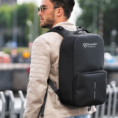 Man wearing backpack with promotion products logo