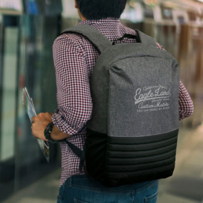 Man in checkered shirt with promotional backpack