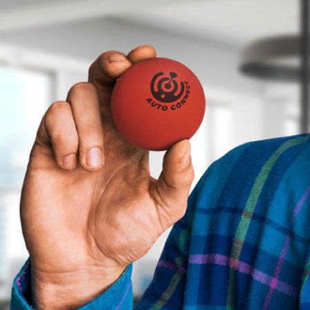Person holding branded high bounce ball