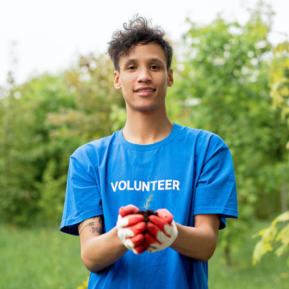 Man holding tree sapling
