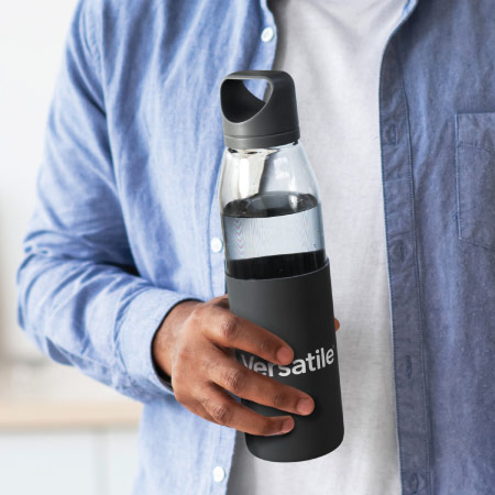Man holding promotional glass water bottle