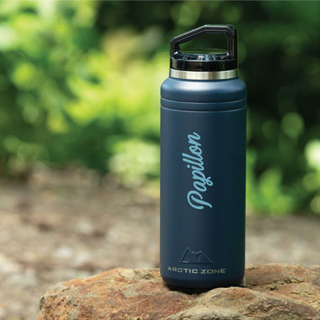 A promotional arctic zone drink bottle with a name written on it.