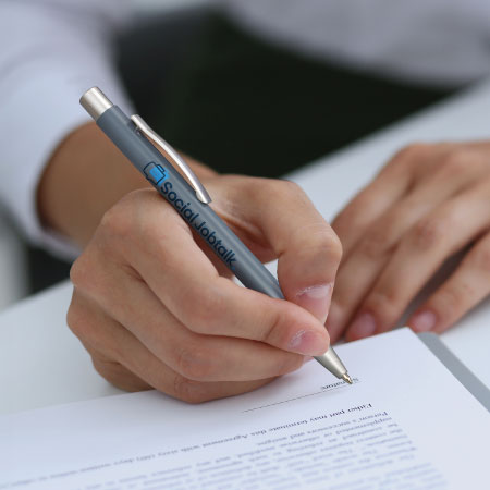 Promotional pen being used in office setting