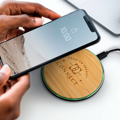 Company branded wireless charger with phone above