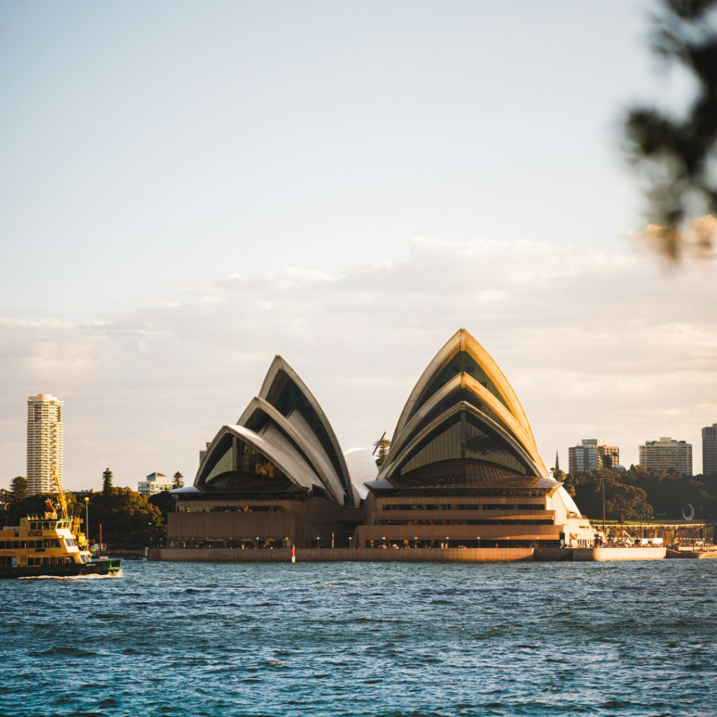 Sydney NSW Landmark – Government & Council Engagement Events Sydney Opera House at sunset seen from the harbour, New South Wales, Australia.