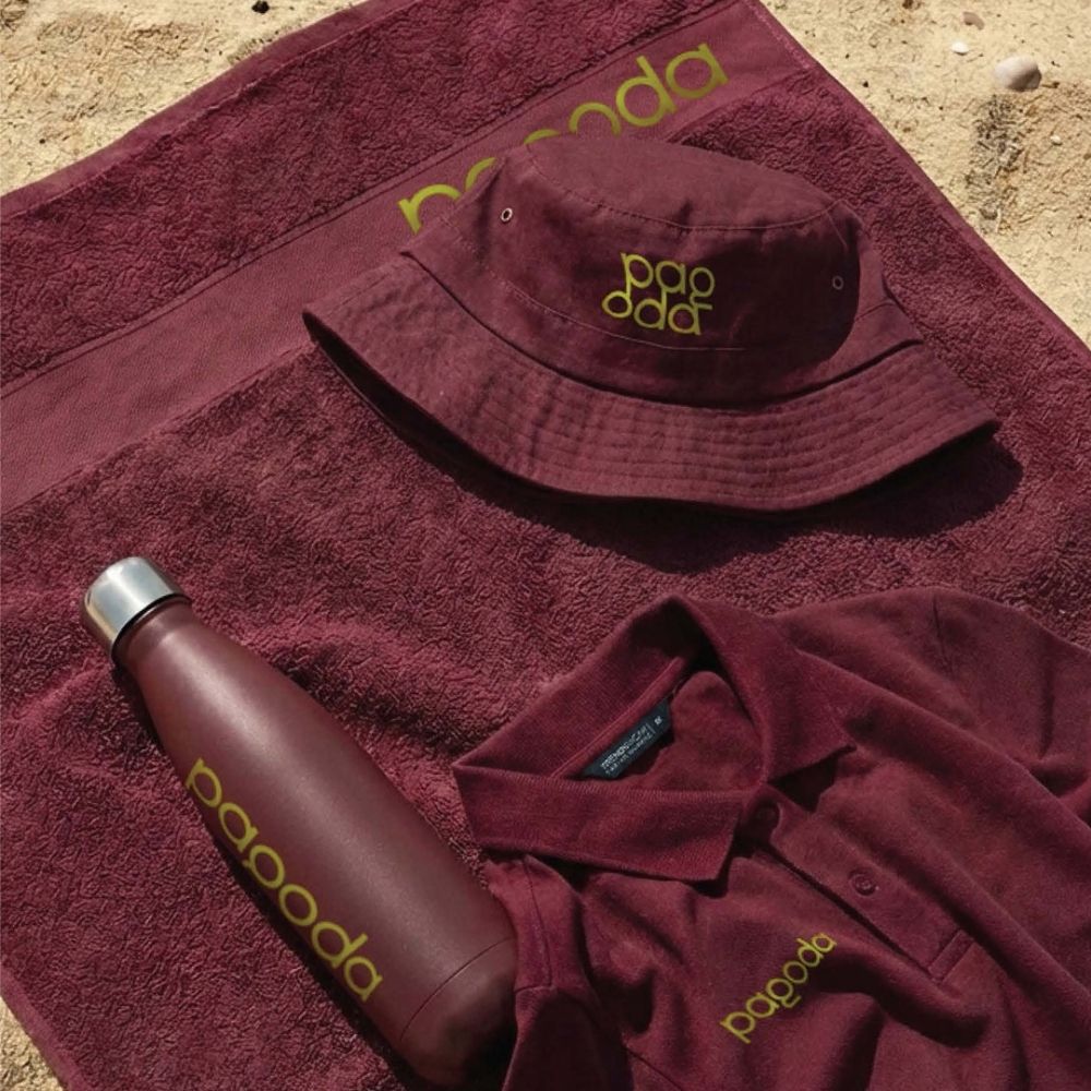 Premium Branded Merchandise and Apparel Coordinated burgundy branded merchandise including a bucket hat, drink bottle, polo shirt and towel