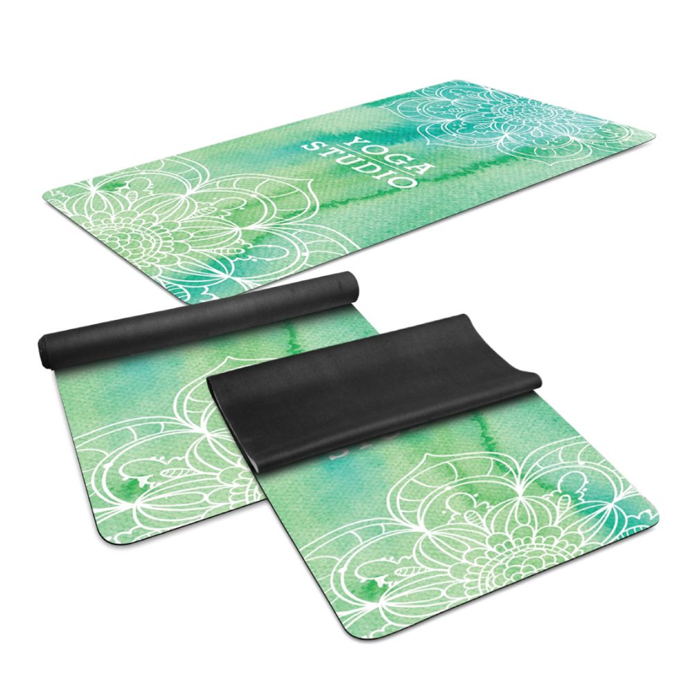 Custom Printed Yoga Mats – Branded Fitness & Pilates Merchandise Custom printed green yoga mats with white floral patterns and Yoga Studio branding, featuring black undersides, ideal for promotional gym merchandise and Pilates studio gifts.